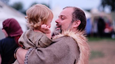 Tyr Brenna takes a moment to celebrate with little Astrid (left)