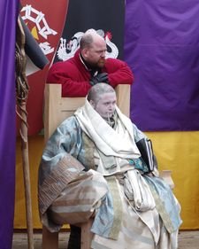 Seated figure in Urizen robes.