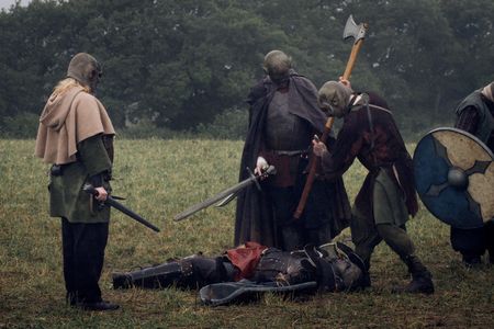 Druj orcs preparing to execute some fallen fella.
