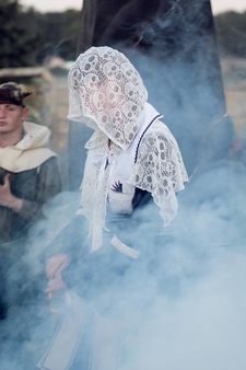 This cowl also suggests a veil.
