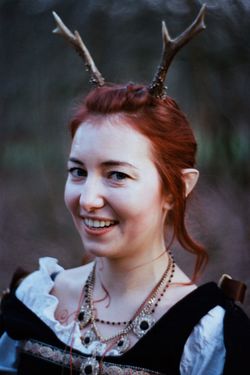 Doctor Beatrix Amalia von Holfried zu Holberg primarily expresses her lineage through her horns, her pointed ears, and her forthright character.