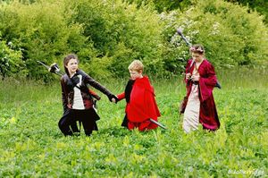 Bella Loreal and Owain Loreal seeking adventure, with the guidance of their "cousin" Pickle Foxden, Navarri scout