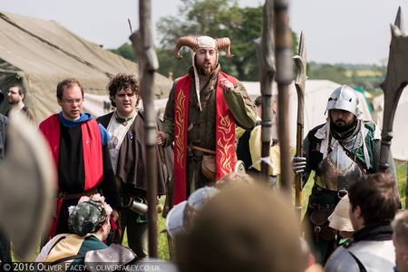 A range of Marcher armour styles including an unarmoured friar, lightly armoured cambion, and heavily armoured soldier.