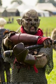 Irontide Rek remembers the centuries of slavery his people endured by wrapping his wrist and neck; the crimson cloth has a particular significance to his ancestors.