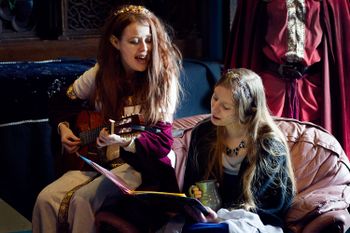 The first High Bard, Kaewynn de Launcet (L) makes music with Vivienne de Carsenere (R).