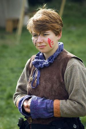 Layers of well-worn, practical wool and leather in natural shades often serve as the foundation of Navarr costume.